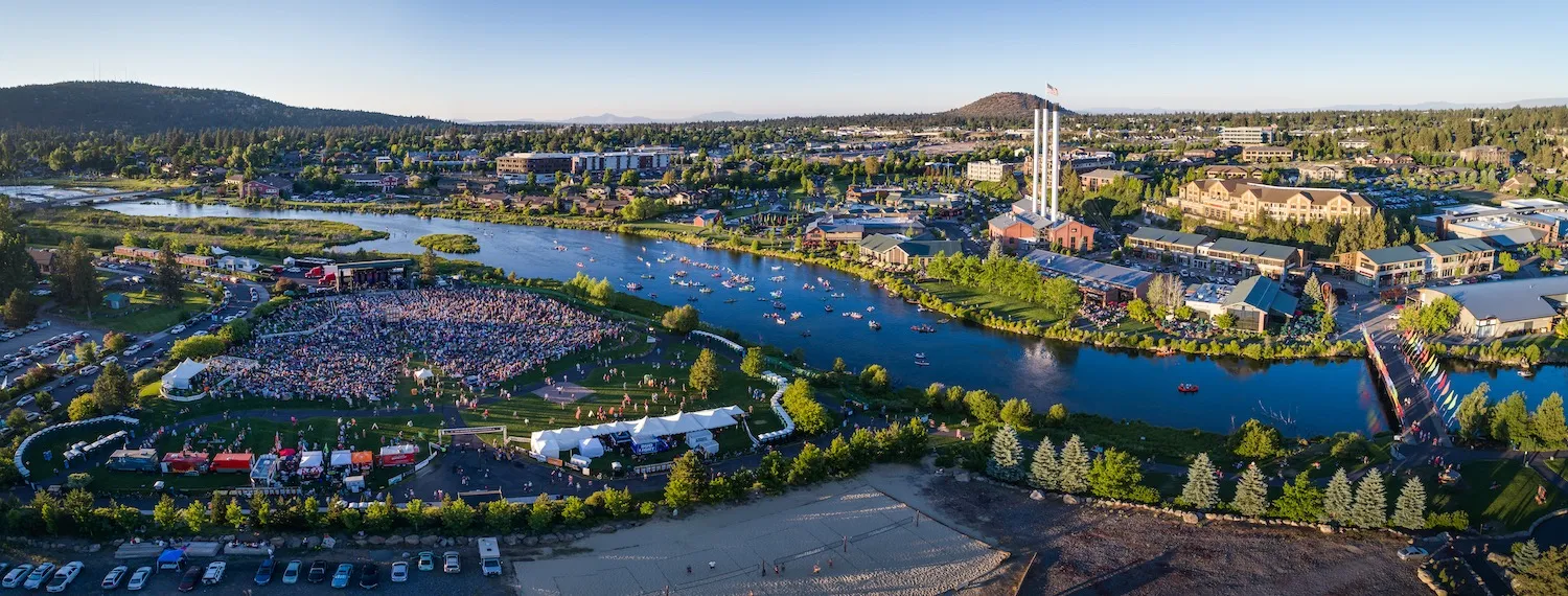 Aerial panorama of Bend’s Old Mill District, the Deschutes River and outdoor amphitheater