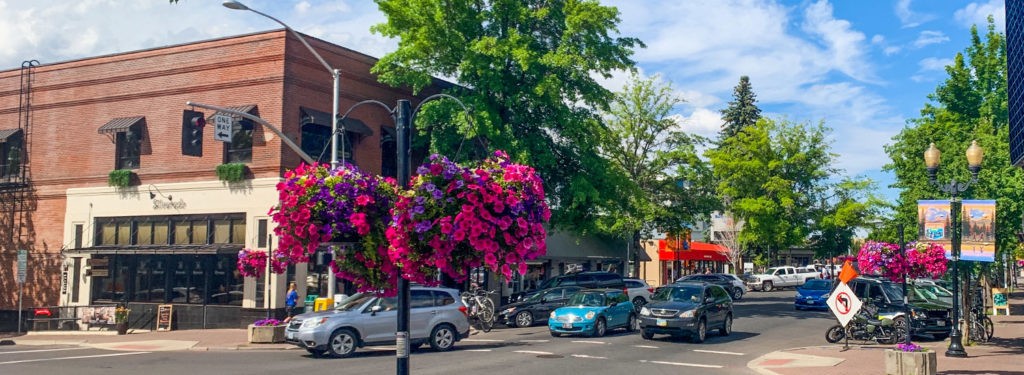 Brick storefronts and tree-lined streets in downtown Bend, Oregon