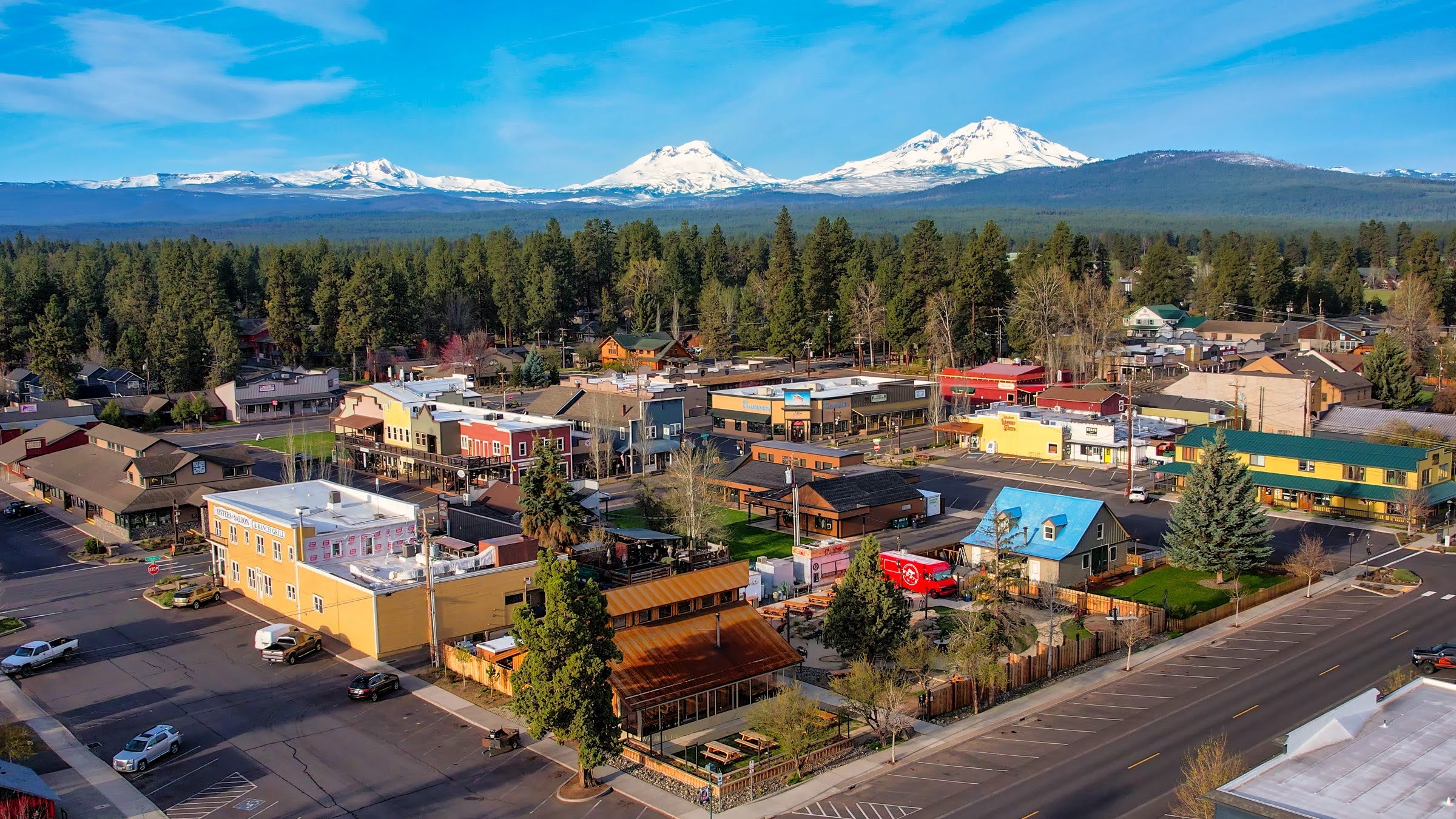 Downtown Sisters with the snow-covered Three Sisters mountains behind the town