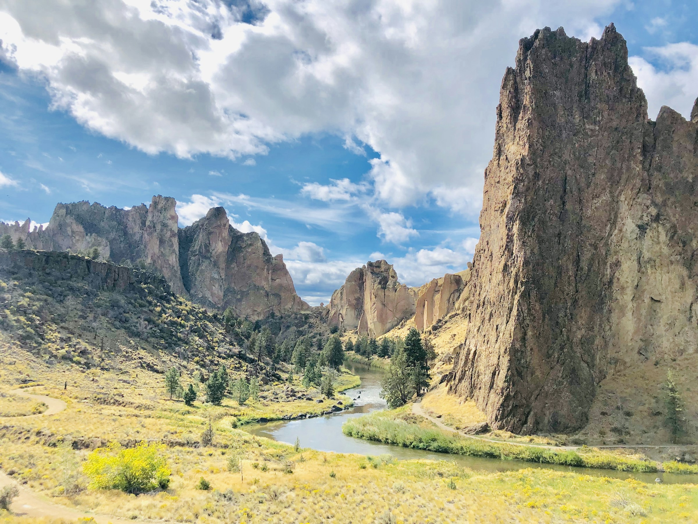 Sunlit Smith Rock cliffs above the winding Crooked River in Central Oregon
